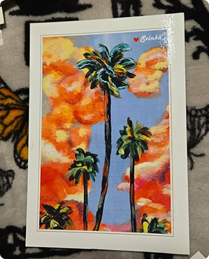 Bold acrylic postcard of palm trees silhouetted against a fiery orange sunset