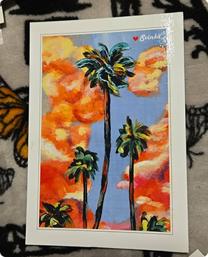 Bold acrylic postcard of palm trees silhouetted against a fiery orange sunset